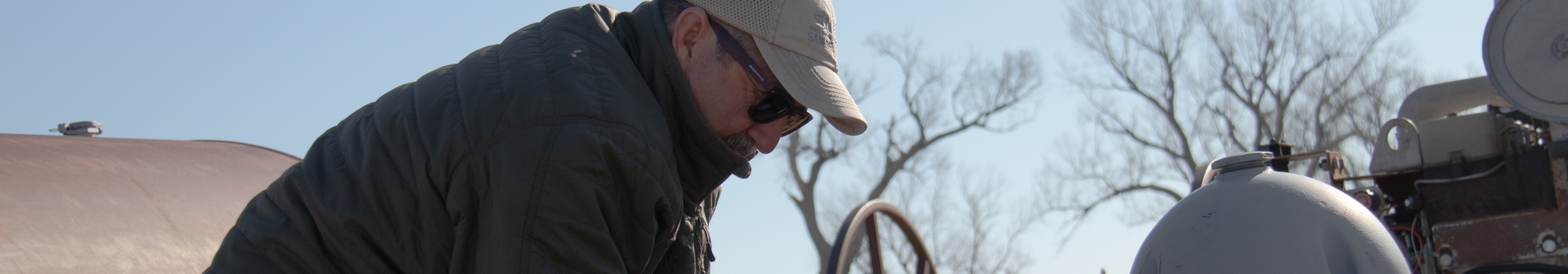 Ken Dawson measuring a well